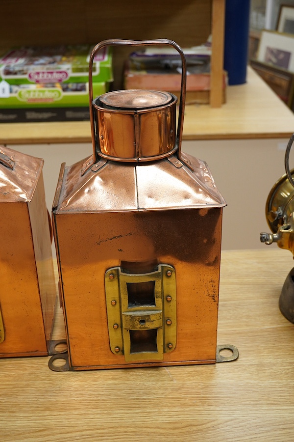 A pair of copper marine or railway oil lamps (missing burners and reservoirs), 44cm high. Condition - fair.